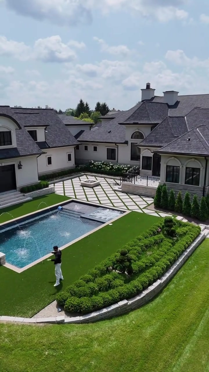 Luxury Bloomfield Hills estate with a pool and landscaped grounds at 575 Chase Lane